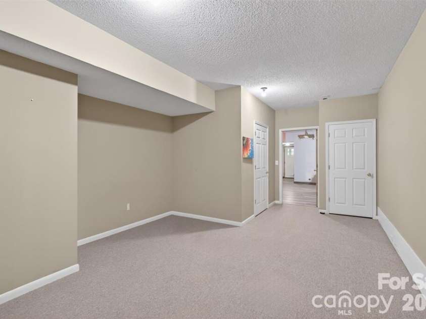 66 Misery Ridge Trail, Mill Spring, NC 28756.  MLS# CAR4385906, YatesRealty ID 30739. View toward entry of bonus room #2.