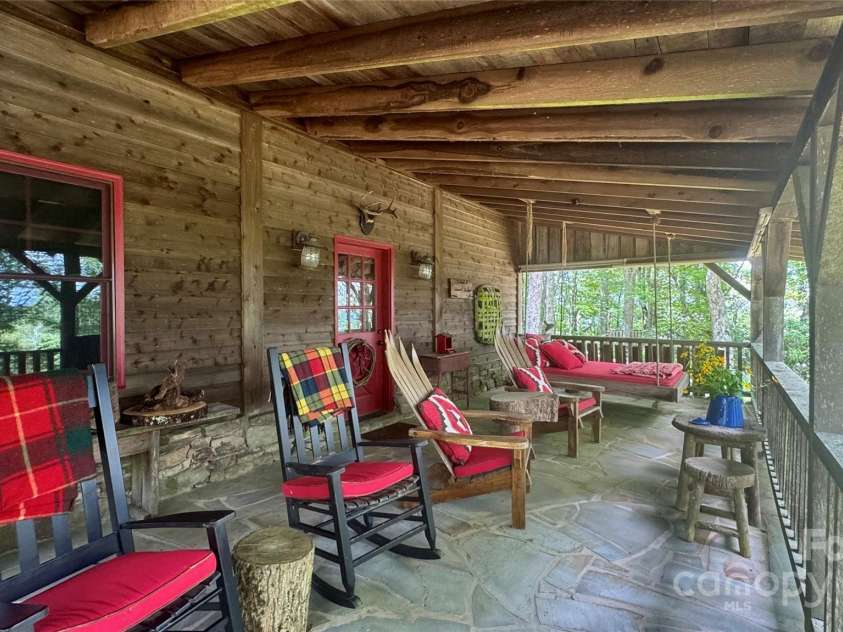 50 Mountain Top Lane, Mars Hill, NC 28754.  MLS# CAR4276175, YatesRealty ID 30742. Incredible covered patio for entertaining guests.