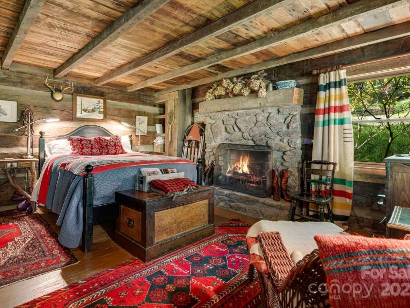 50 Mountain Top Lane, Mars Hill, NC 28754.  MLS# CAR4276175, YatesRealty ID 30742. Main level primary bedroom