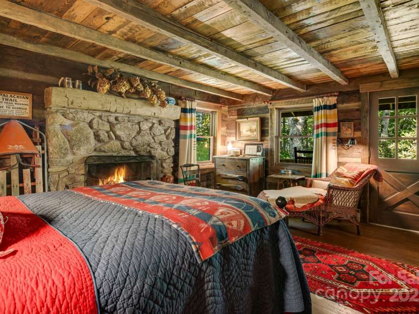 50 Mountain Top Lane, Mars Hill, NC 28754.  MLS# CAR4276175, YatesRealty ID 30742. Main level primary bedroom with private covered deck.