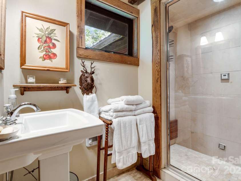 50 Mountain Top Lane, Mars Hill, NC 28754.  MLS# CAR4276175, YatesRealty ID 30742. Upper level full bath with steam shower.