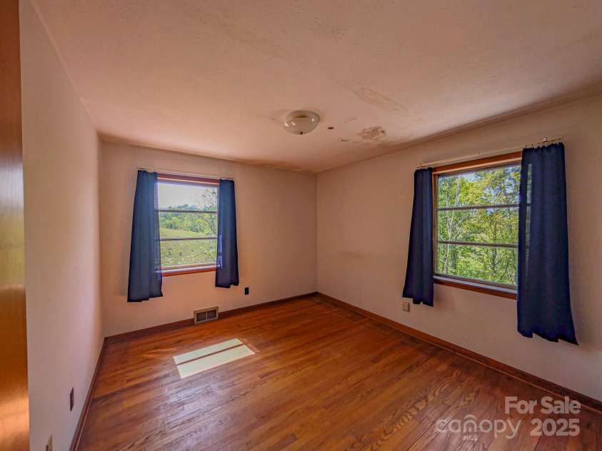 56 Gill Branch Road, Weaverville, NC 28787.  MLS# CAR4270678, YatesRealty ID 3075. Gorgeous hardwood floors indicating the farmer's wife made him take his muddy boots off before entering.