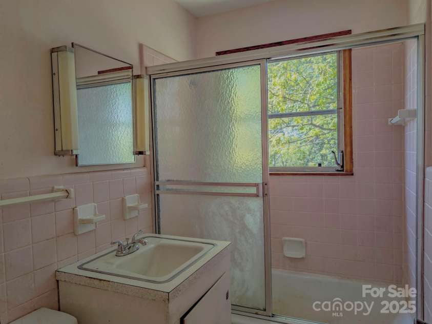 56 Gill Branch Road, Weaverville, NC 28787.  MLS# CAR4270678, YatesRealty ID 3075. Old bathroom needs some attention and a new tub but the guts are all there and the unfinished basement makes updates easy.