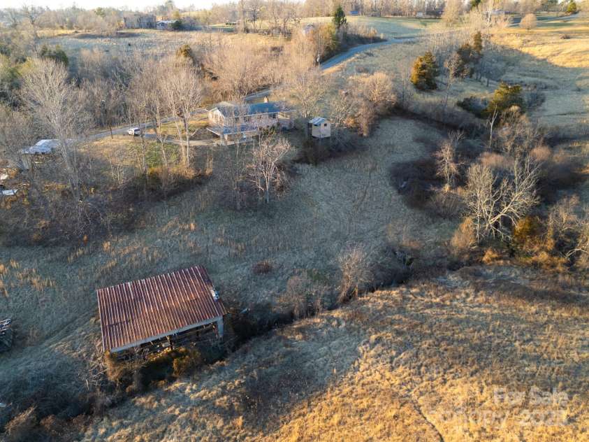 56 Gill Branch Road, Weaverville, NC 28787.  MLS# CAR4270678, YatesRealty ID 3075. The green will replace the brown come spring.