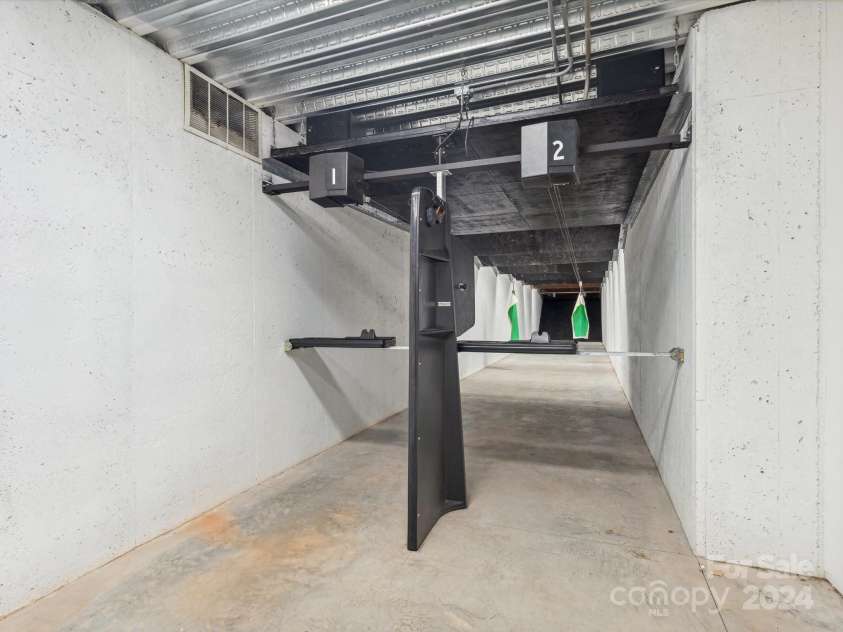 9044 Island Point Road, Charlotte, NC 28278.  MLS# CAR4135509, YatesRealty ID 3075. In home full gun range with automatic targets