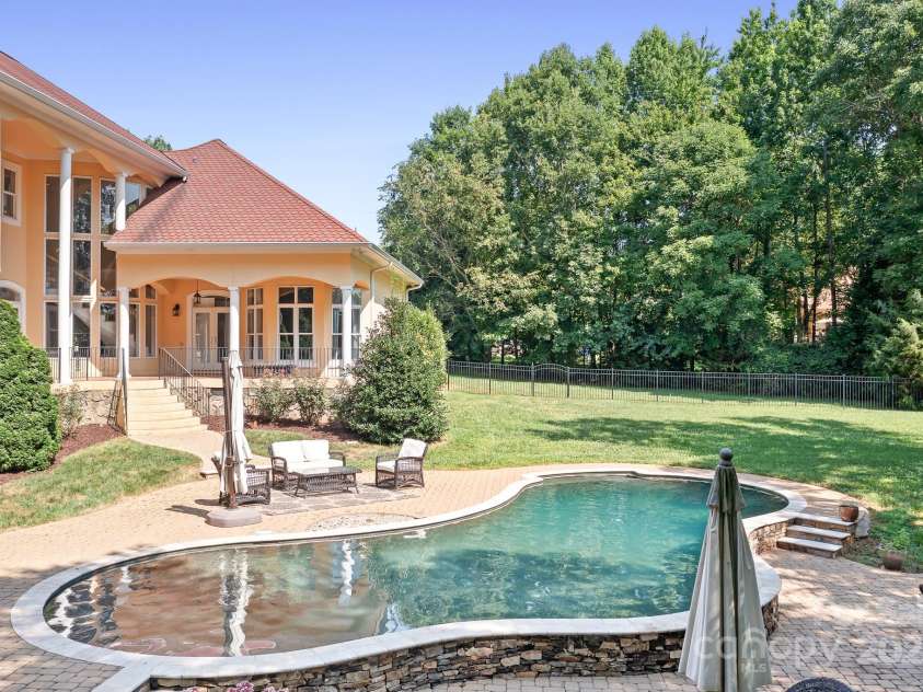 149 Vista Bluff Lane, Mooresville, NC 28117.  MLS# CAR4276049, YatesRealty ID 30753. Back view of the pool