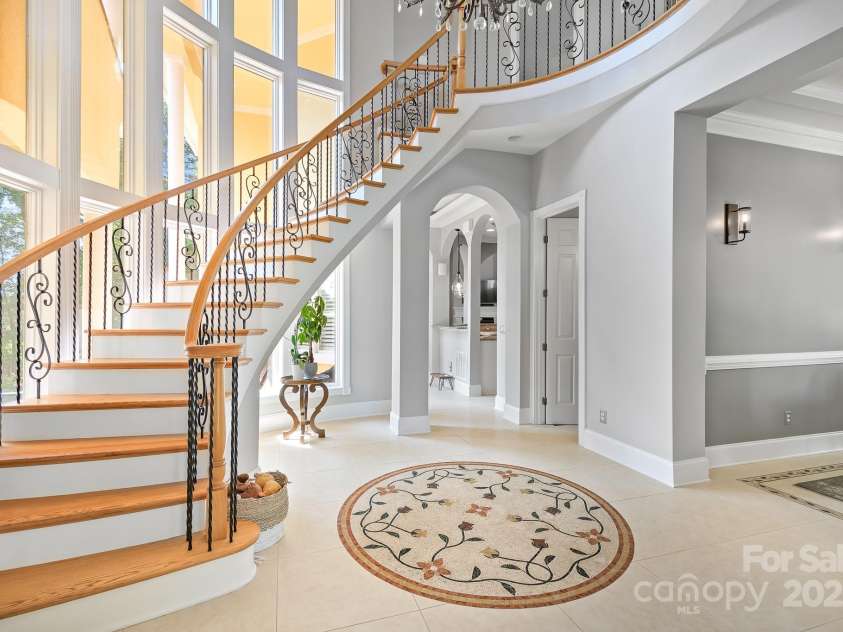 149 Vista Bluff Lane, Mooresville, NC 28117.  MLS# CAR4276049, YatesRealty ID 30753. Grand Staircase Entrance