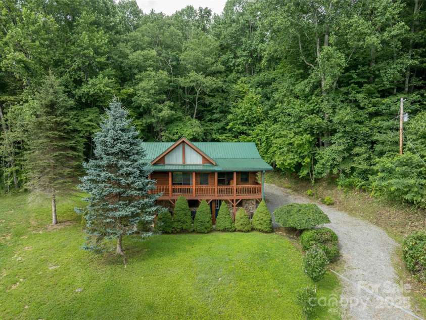 125 Apple Blossom Lane, Maggie Valley, NC 28751.  MLS# CAR4285766, YatesRealty ID 30755. Pull into basement at end pf the road