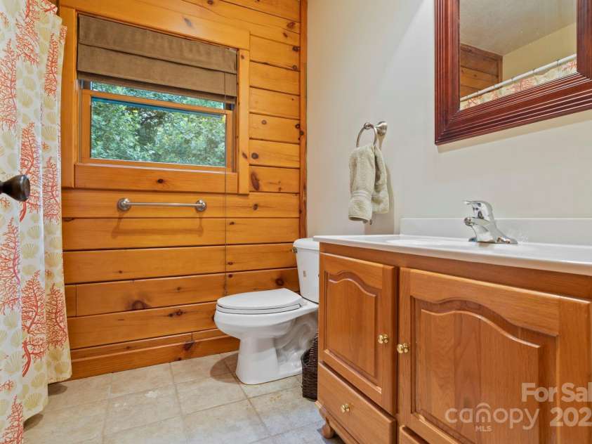 266 Rhododendron Drive, Saluda, NC 28773.  MLS# CAR4288597, YatesRealty ID 30762. Guest bath on main level