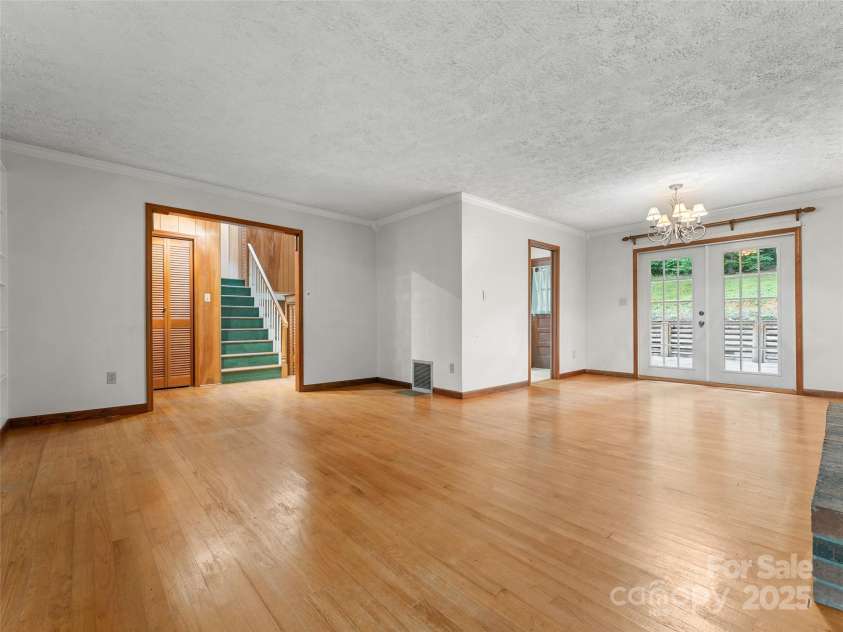 138 Stillwagon Lane, Cedar Mountain, NC 28718.  MLS# CAR4288259, YatesRealty ID 30766. Living Room and Dining Area