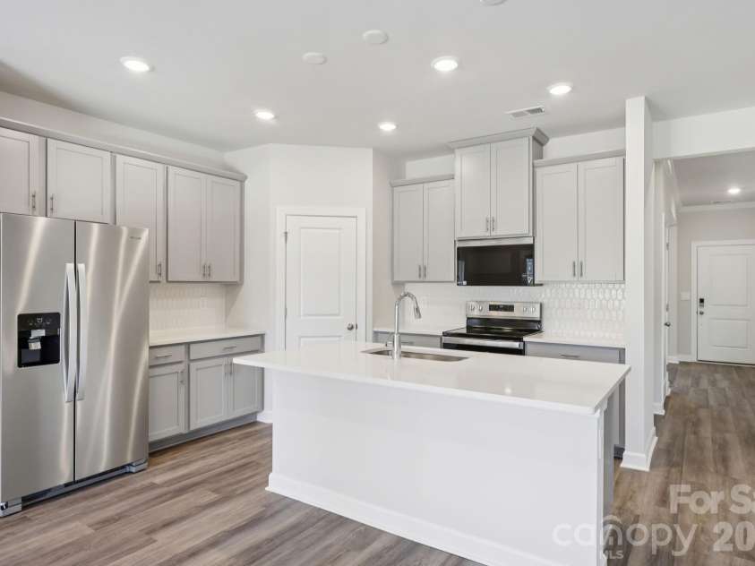 1605 Harper Landing Boulevard, Stanley, NC 28164.  MLS# CAR4394176, YatesRealty ID 30768. Photo is not of the actual home, but is an inspirational photo of builder’s model home and may depict options, furnishings, and/or decorator features that are not includedPhoto is not of the actual home, but is
