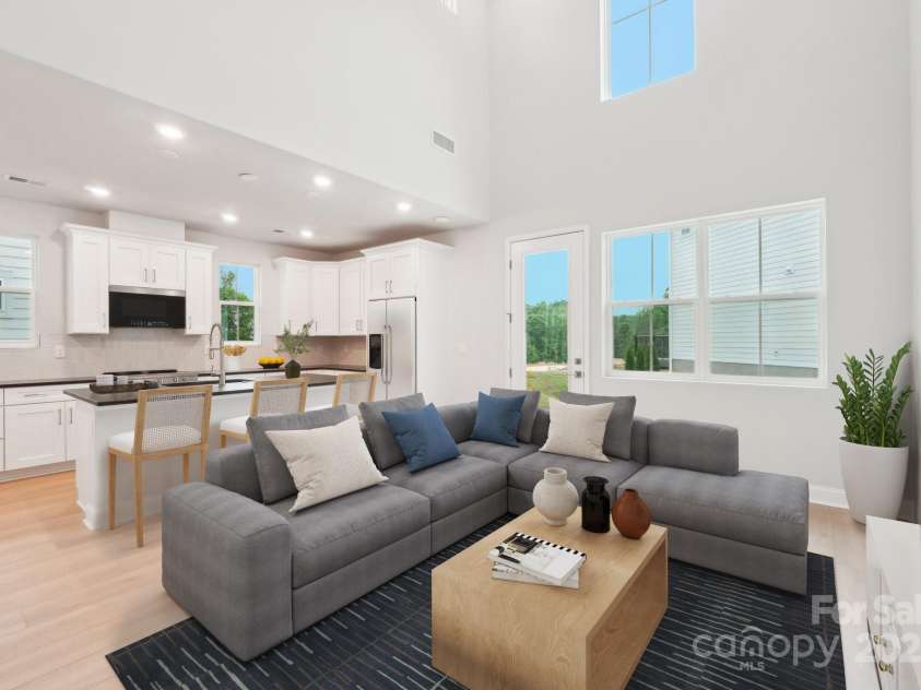 816 Terra Drive, Tega Cay, SC 29708.  MLS# CAR4289553, YatesRealty ID 30770. Virtually Staged Great Room to Kitchen