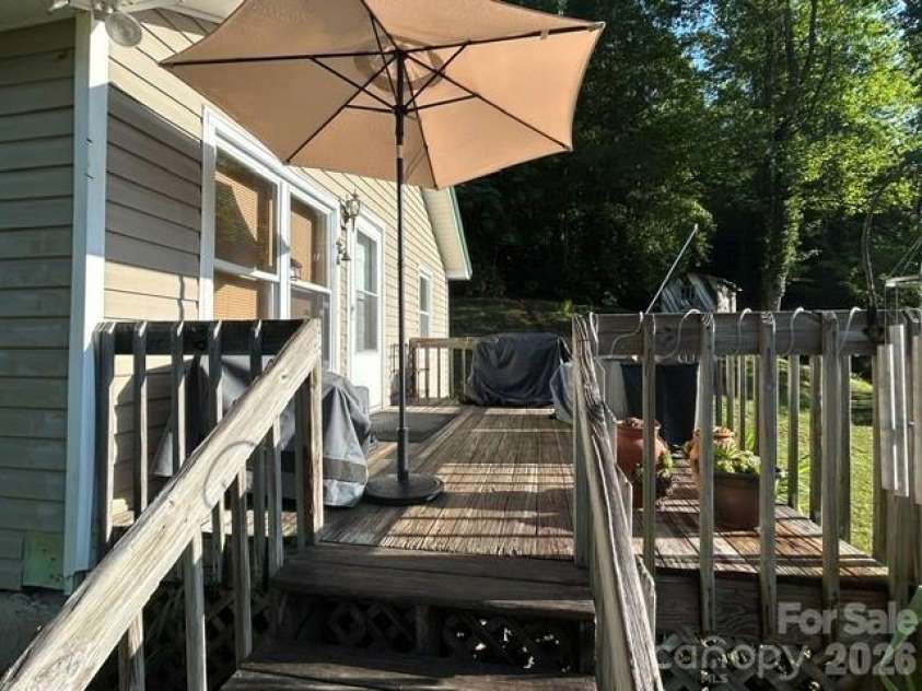 726 Israel Road, Brevard, NC 28712.  MLS# CAR4392517, YatesRealty ID 30772. Front deck