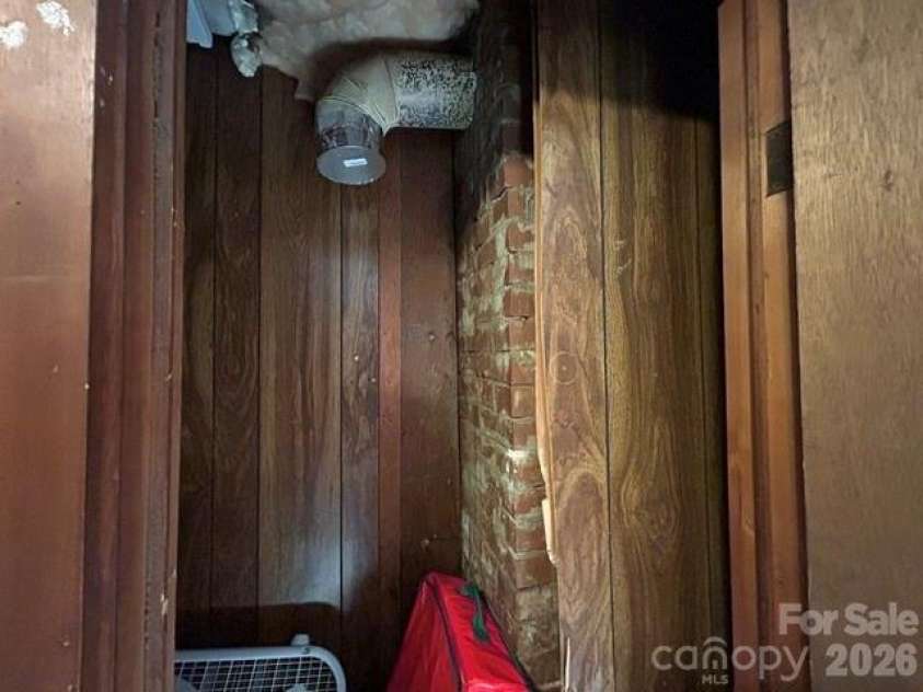 726 Israel Road, Brevard, NC 28712.  MLS# CAR4392517, YatesRealty ID 30772. Storage closet with old chimney
