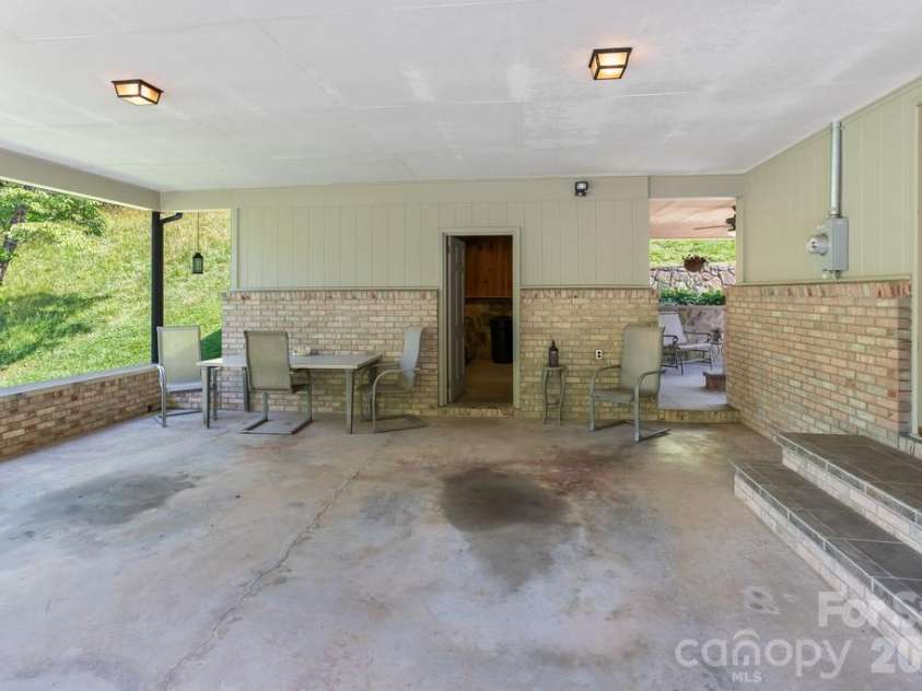 293 Dillardtown Road, Sylva, NC 28779.  MLS# CAR4392955, YatesRealty ID 30775. 25x25 covered carport leads directly into kitchen