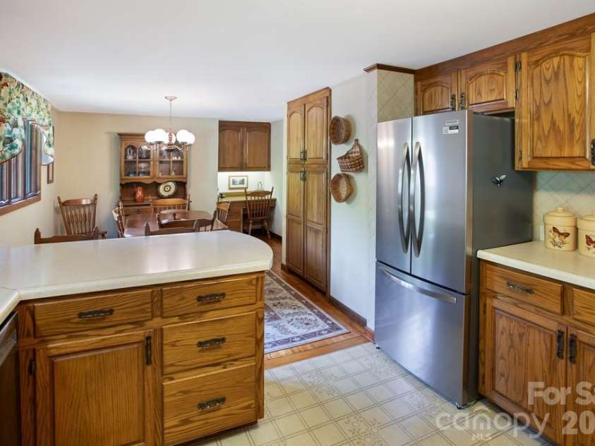 293 Dillardtown Road, Sylva, NC 28779.  MLS# CAR4392955, YatesRealty ID 30775. Beautiful handcrafted cabinets and breakfast bar