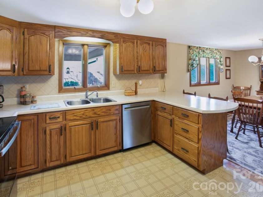 293 Dillardtown Road, Sylva, NC 28779.  MLS# CAR4392955, YatesRealty ID 30775. Casement windows and dedicated dining area