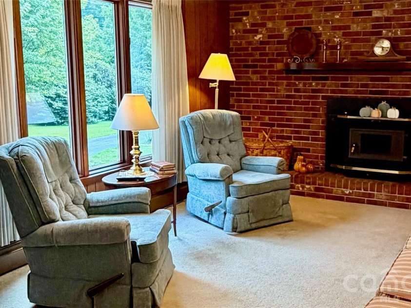 293 Dillardtown Road, Sylva, NC 28779.  MLS# CAR4392955, YatesRealty ID 30775. Great light and brick detail on the fireplace