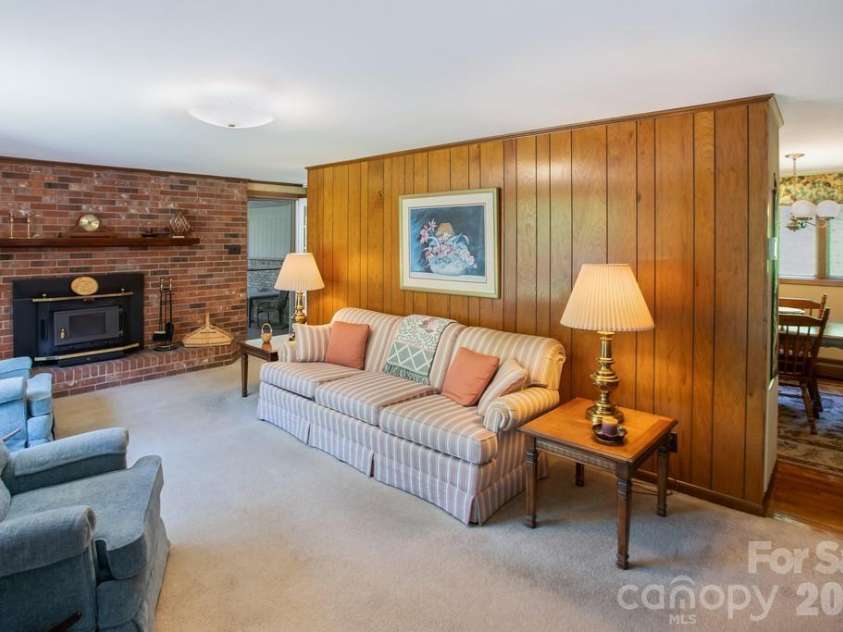 293 Dillardtown Road, Sylva, NC 28779.  MLS# CAR4392955, YatesRealty ID 30775. Living room opens to kitchen and dining area
