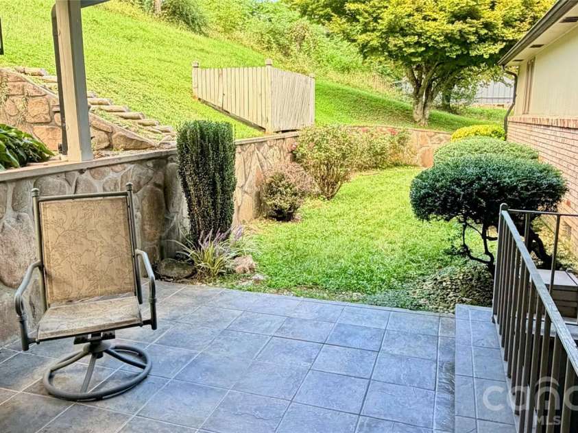 293 Dillardtown Road, Sylva, NC 28779.  MLS# CAR4392955, YatesRealty ID 30775. Relaxing and private stone-walled patio