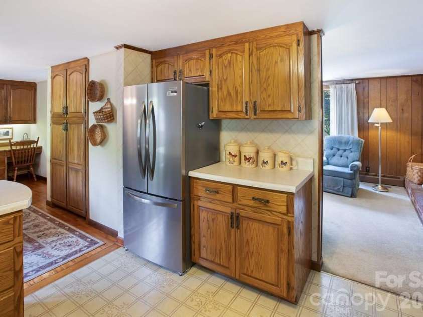 293 Dillardtown Road, Sylva, NC 28779.  MLS# CAR4392955, YatesRealty ID 30775. Spacious kitchen with new appliances and pantry cabinet