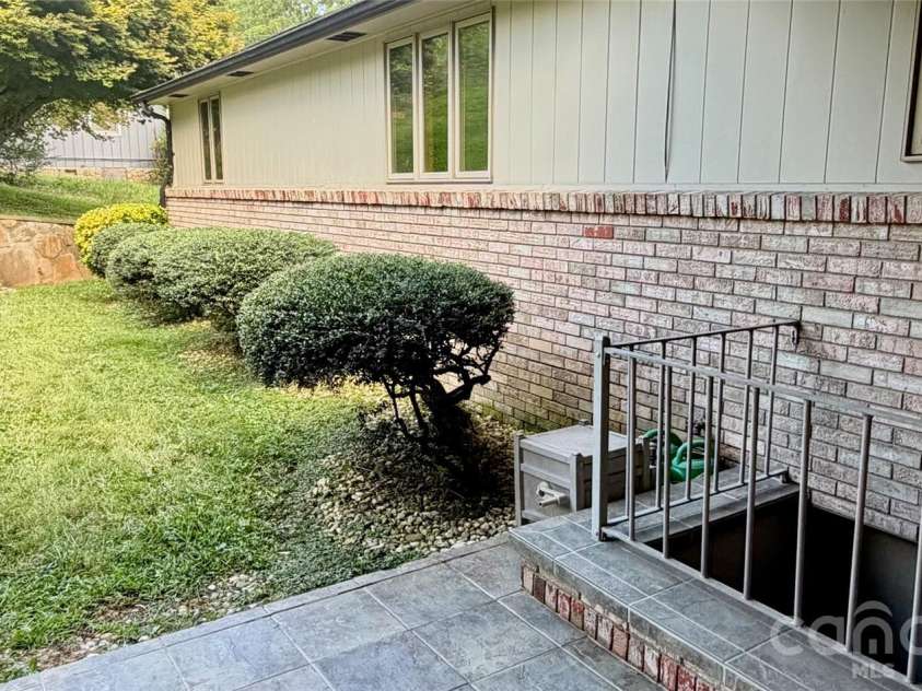 293 Dillardtown Road, Sylva, NC 28779.  MLS# CAR4392955, YatesRealty ID 30775. Tidy backyard
