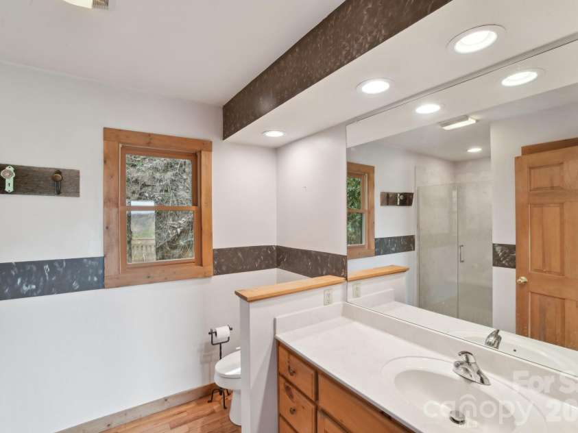 1426 Setzer Cove Road, Maggie Valley, NC 28751.  MLS# CAR4249259, YatesRealty ID 3078. Ensuite bath in the primary bedroom