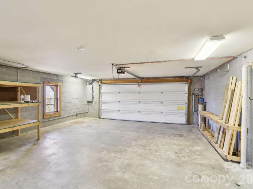 1426 Setzer Cove Road, Maggie Valley, NC 28751.  MLS# CAR4249259, YatesRealty ID 3078. Garage with storage