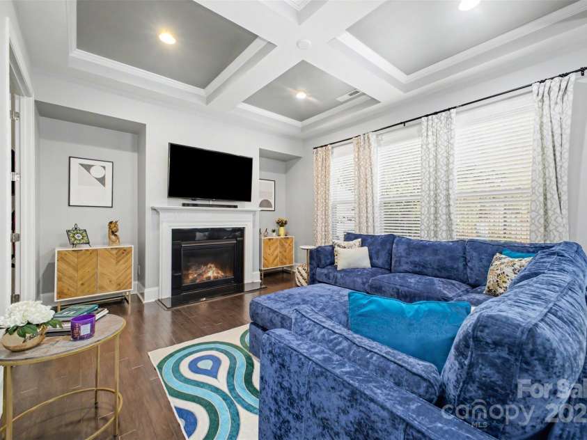 5410 Shannon Bell Lane, Charlotte, NC 28277.  MLS# CAR4326663, YatesRealty ID 30782. Living room with coffered ceiling and gas fireplace