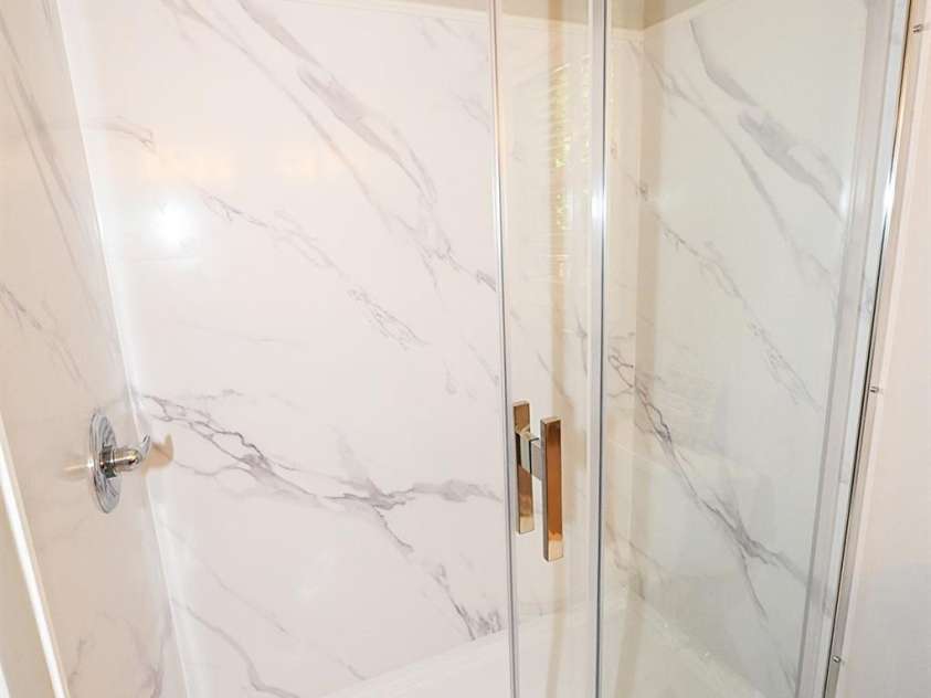 1035 24th Street, Newton, NC 28658.  MLS# CAR4391518, YatesRealty ID 30783. New shower in primary bathroom