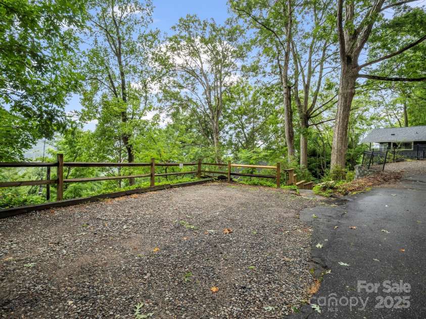 6 Delano Road, Asheville, NC 28805.  MLS# CAR4287073, YatesRealty ID 30799. Parking Right Above the Cabin