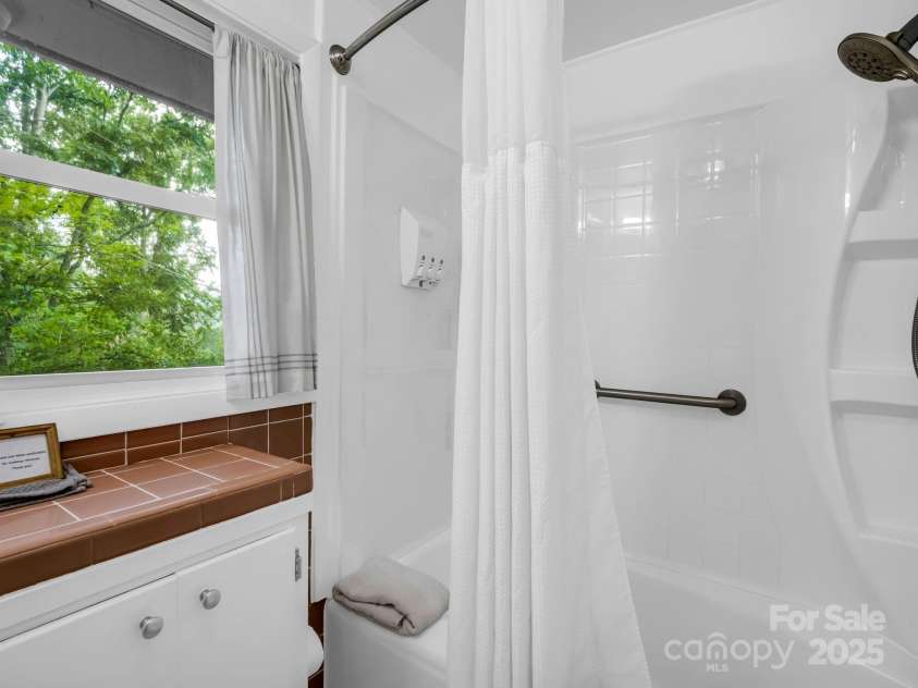 6 Delano Road, Asheville, NC 28805.  MLS# CAR4287073, YatesRealty ID 30799. Shower in the Treetops!