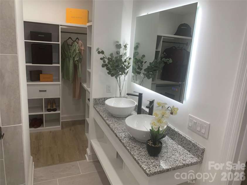 2524 Pickway Drive, Charlotte, NC 28269.  MLS# CAR4330657, YatesRealty ID 3080. Optimize space with this rloating vanity with storage and fog removing option on the mirror