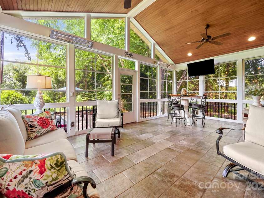 8173 Shannon Woods Lane, Weddington, NC 28104.  MLS# CAR4274910, YatesRealty ID 30803. Enjoy our cool summer evenings and shade covered three season room