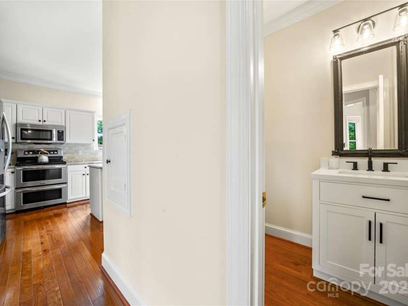 8173 Shannon Woods Lane, Weddington, NC 28104.  MLS# CAR4274910, YatesRealty ID 30803. Half bath with new vanity