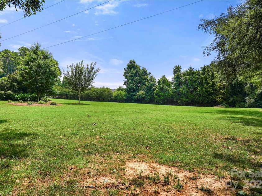 8173 Shannon Woods Lane, Weddington, NC 28104.  MLS# CAR4274910, YatesRealty ID 30803. View of backyard