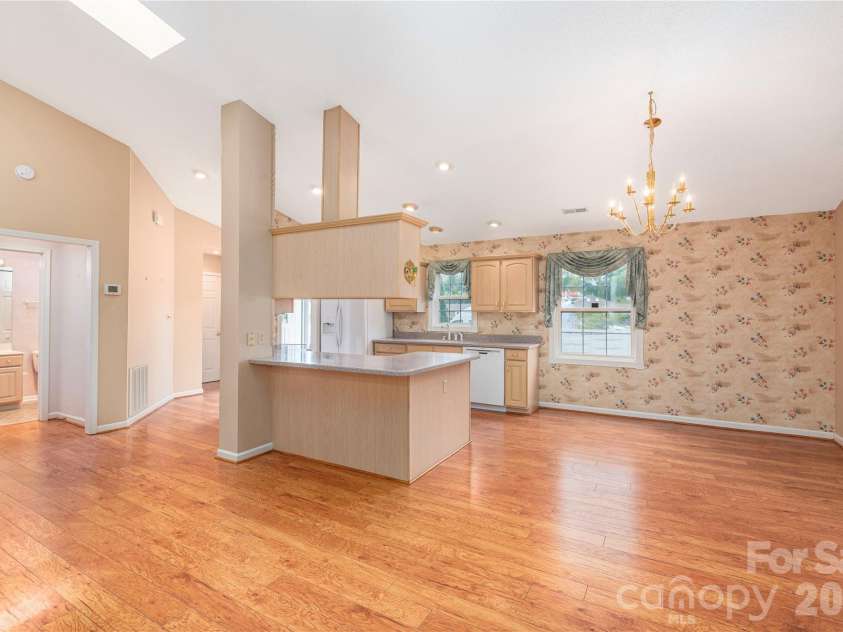 11 Heather Way, Candler, NC 28715.  MLS# CAR4381807, YatesRealty ID 30816. Living room looking towards kitchen