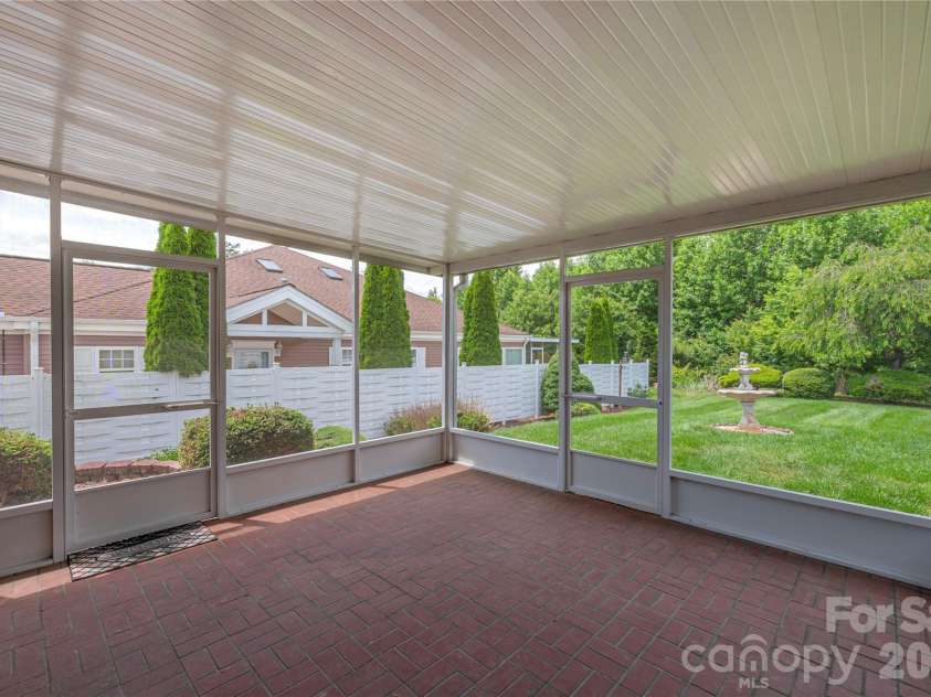 11 Heather Way, Candler, NC 28715.  MLS# CAR4381807, YatesRealty ID 30816. Screened back patio