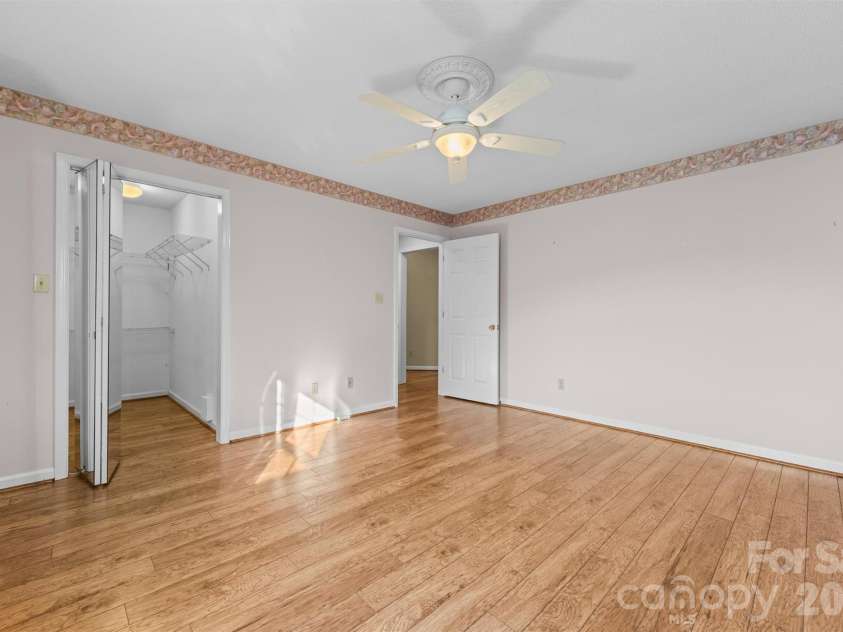 11 Heather Way, Candler, NC 28715.  MLS# CAR4435502, YatesRealty ID 30816. Guest Bedroom with walk in closet