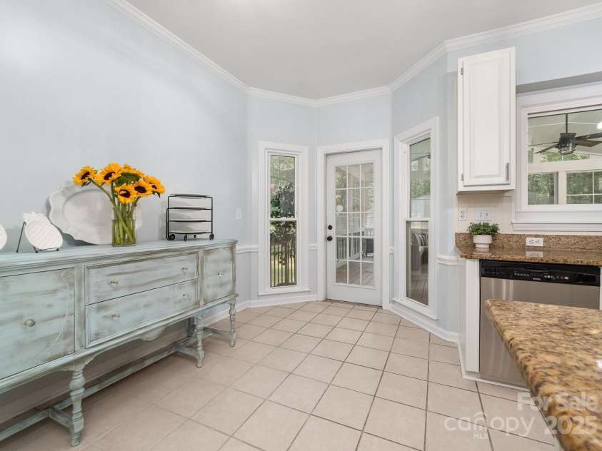 12214 Provincetowne Drive, Charlotte, NC 28277.  MLS# CAR4282352, YatesRealty ID 30824. Breakfast area with access to the screened porch