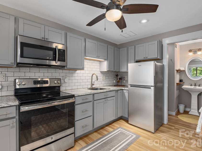 107 Buffalo Trail, Asheville, NC 28805.  MLS# CAR4374645, YatesRealty ID 30836. Basement Apartment Kitchen