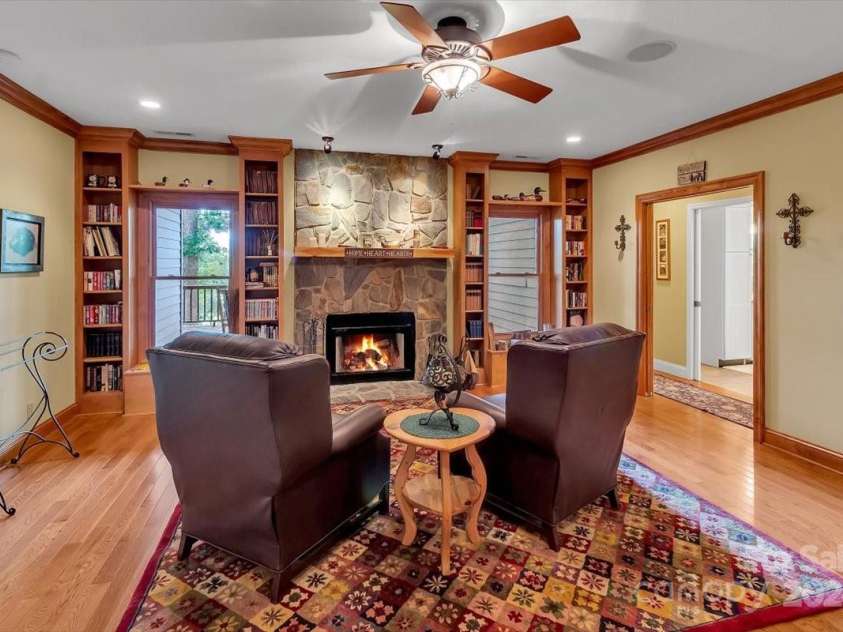 445 Equestrian Drive, Waynesville, NC 28786.  MLS# CAR4186837, YatesRealty ID 3084. Library with Wood Burning Fireplace