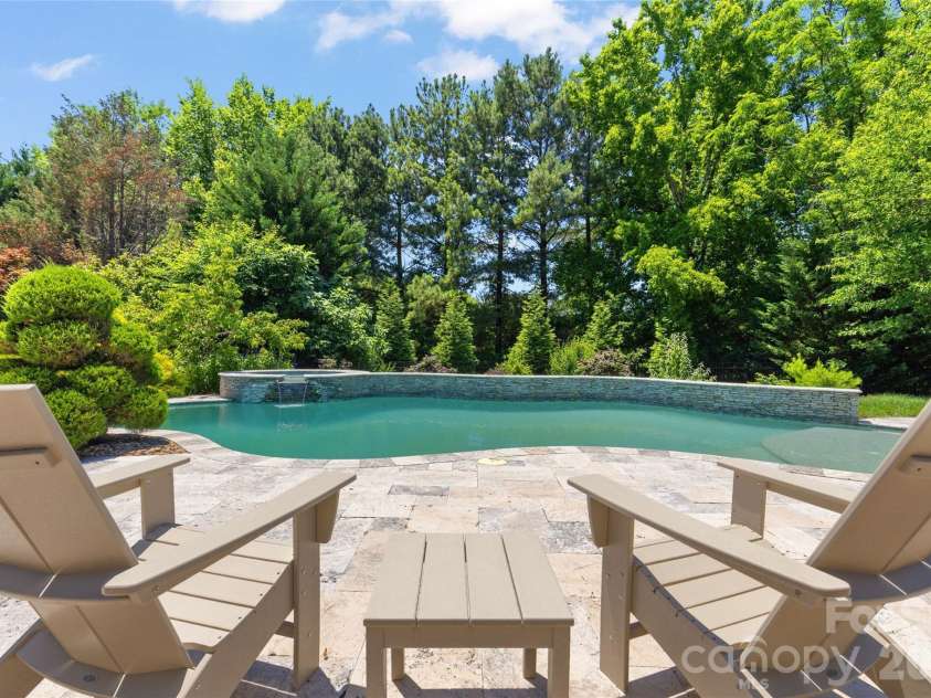 3207 Lakehurst Crossing, Matthews, NC 28104.  MLS# CAR4389517, YatesRealty ID 30843. Lounging pool side