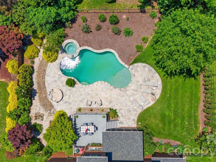 3207 Lakehurst Crossing, Matthews, NC 28104.  MLS# CAR4389517, YatesRealty ID 30843. Resort style backyard