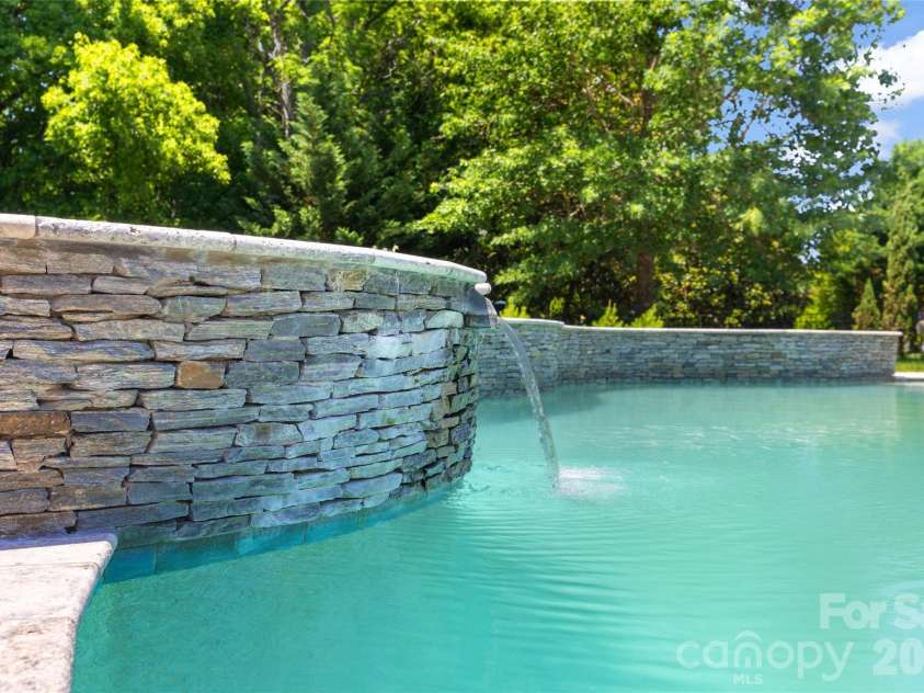 3207 Lakehurst Crossing, Matthews, NC 28104.  MLS# CAR4389517, YatesRealty ID 30843. Spa with waterfall