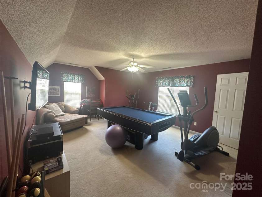 5845 Mahogany Place, Concord, NC 28025.  MLS# CAR4283667, YatesRealty ID 30850. Large bonus room 15 feet in length by 14 feet in width. The poo table and accessories will stay!