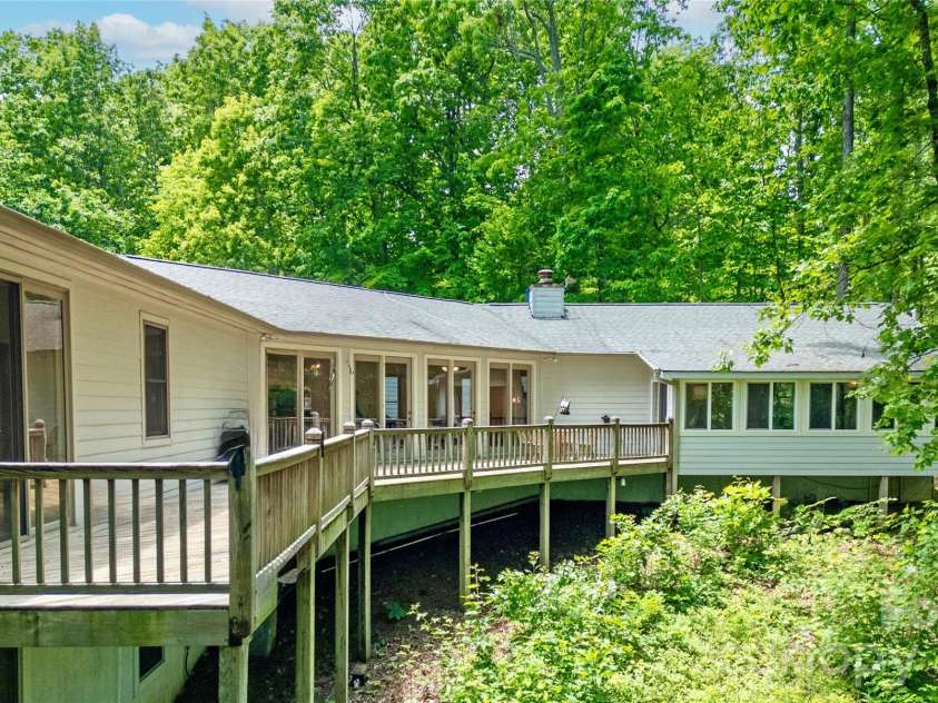 154 Chestnut Lane, Cedar Mountain, NC 28718.  MLS# CAR4388442, YatesRealty ID 30858. Expansive space with sweeping decks
