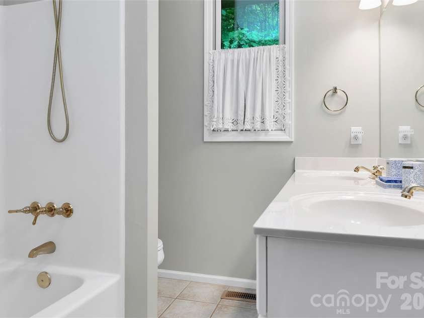 154 Chestnut Lane, Cedar Mountain, NC 28718.  MLS# CAR4388442, YatesRealty ID 30858. Guest house bath