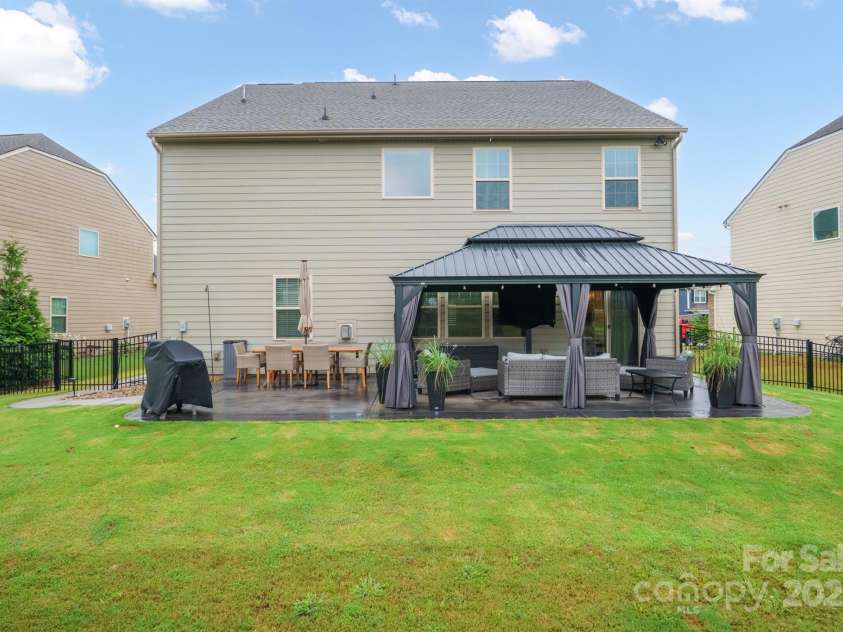 177 Falls Cove Drive, Troutman, NC 28166.  MLS# CAR4290056, YatesRealty ID 30858. ENTERTAINMENT BACKYARD