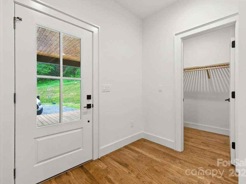 82 Lillycrop Lane, Hendersonville, NC 28792.  MLS# CAR4273359, YatesRealty ID 30864. Back door exits to large covered deck